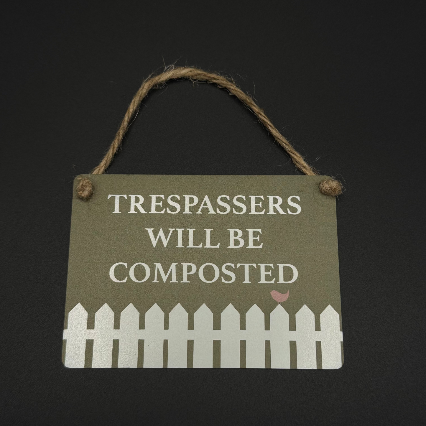 Trespassers will be composted sign