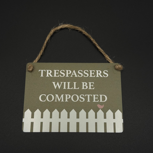 Trespassers will be composted sign